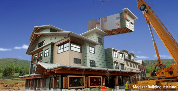 Modular Building Institute image of crane lifting a part of a house above a house